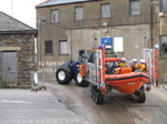 SX26452 Big lifeboat tracktor going up slipway.jpg